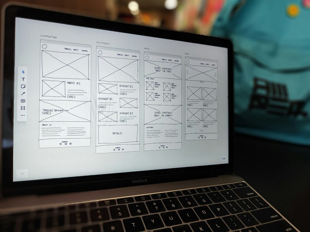 Website wireframe on a laptop screen — business process automation services